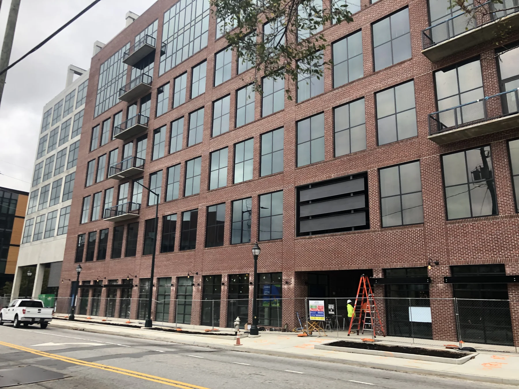 Brick facade and ground-floor storefronts at The Interlock in Westside Atlanta